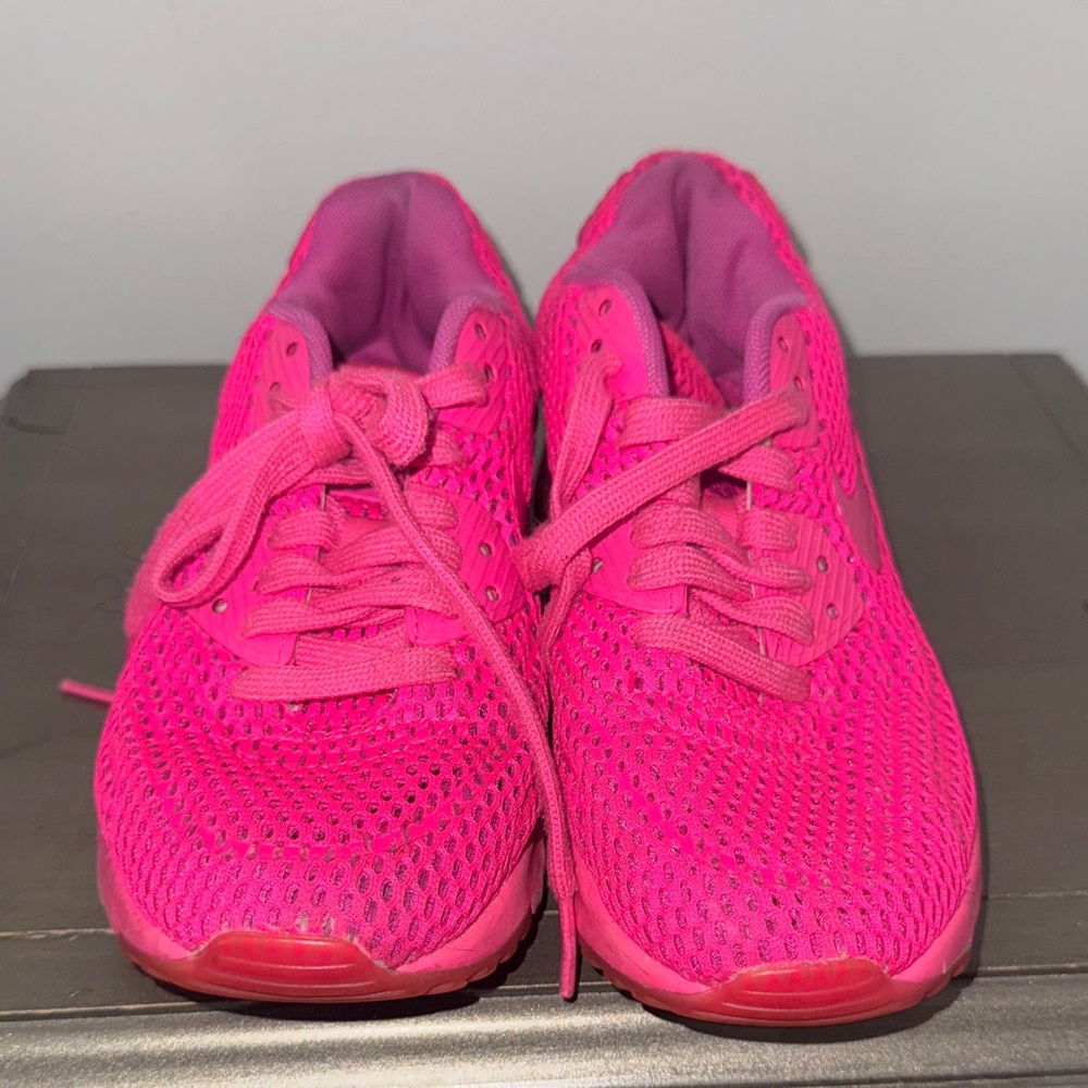 Vibrant Pink Nike sneakers for women